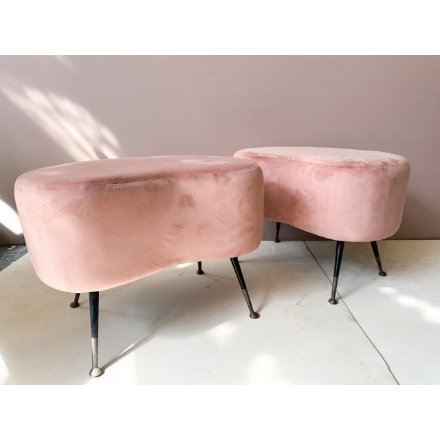Pair of mid-century modern stools from Italy, dating from the 1950s, featuring elegant kidney shaped seats and brass legs....