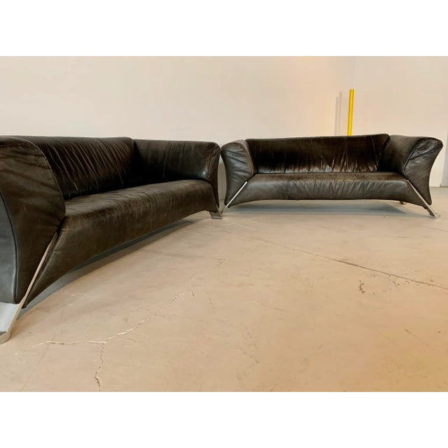 We have this set firsthand. The leather has faded in the sunshine, which contrasts fantastically with the shape and makes...