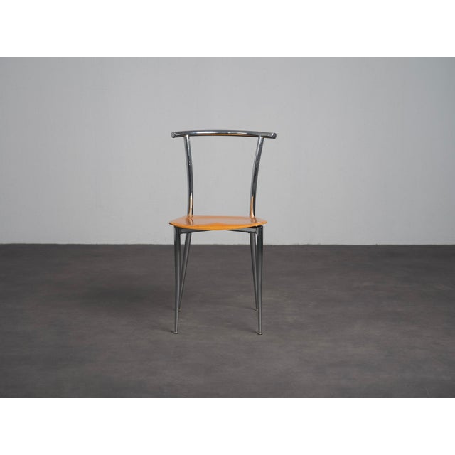 A distinctive set of four postmodern dining chairs produced by segis in italy during the 1990s. The design combines...