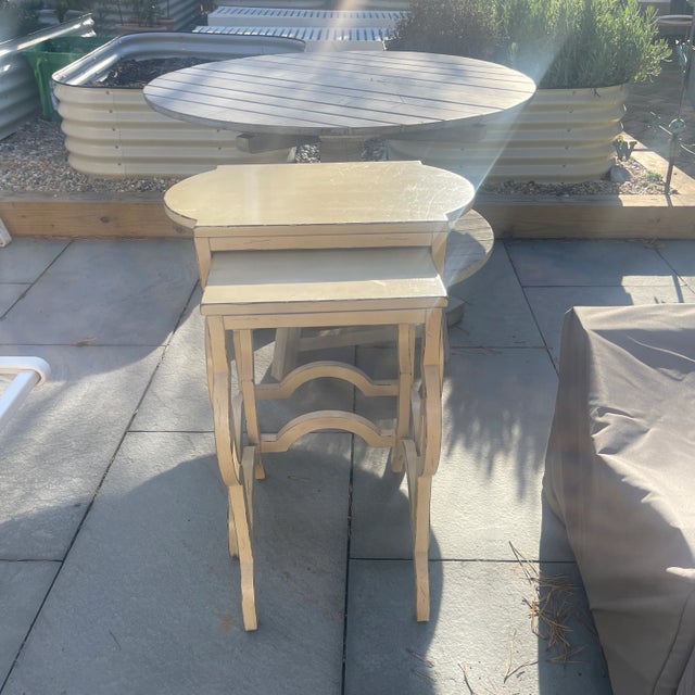 Elegant and timeless, this pair of Baker French Country nesting tables features sculptural curves and a creamy hand-...