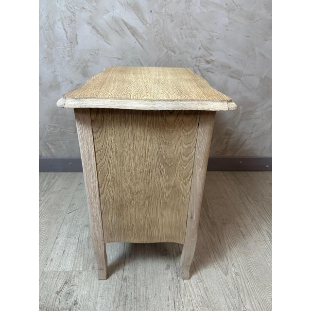 Charming small antique cabinet in oak and oak veneer, compact in size and with clean lines, combining functionality and...