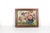 This is a colourful floral still life needlepoint in a wood frame. The wood frame has two thin gold lines and no glass....