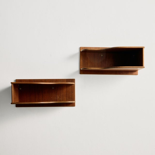 Teak floating nightstands from the 1960s. The surface of the furniture has scratches, stains and wear with some signs of...