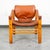 Danish mid-century modern safari chair in brown / tan leather, c. 1950's, having Beech wood frame, hinged back, Thick...