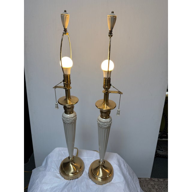 Design Plus Gallery presents a Pair of Empire Column with Brass Table Lamps from Lenox by Quoizel Collection. The lamps...