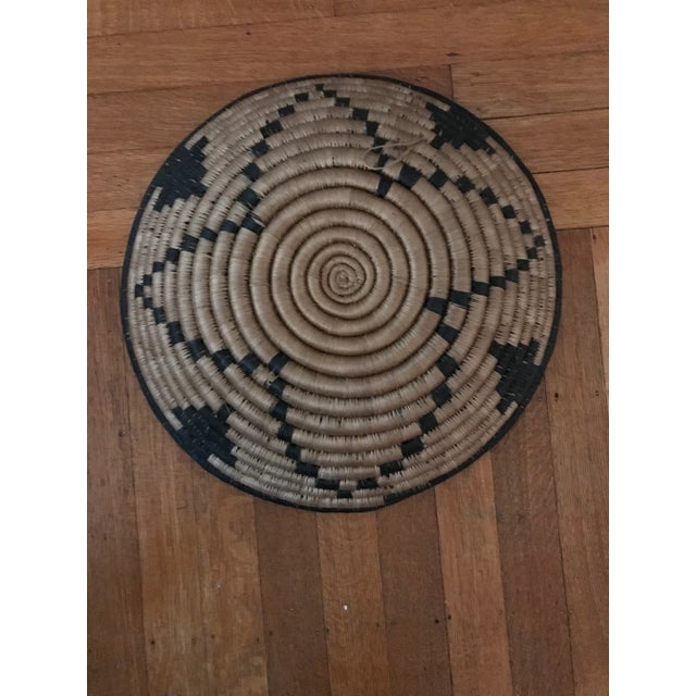 Beautiful round hand-made African woven basket blue and brown. Decorative and functional. Good condition. Aquired at an...