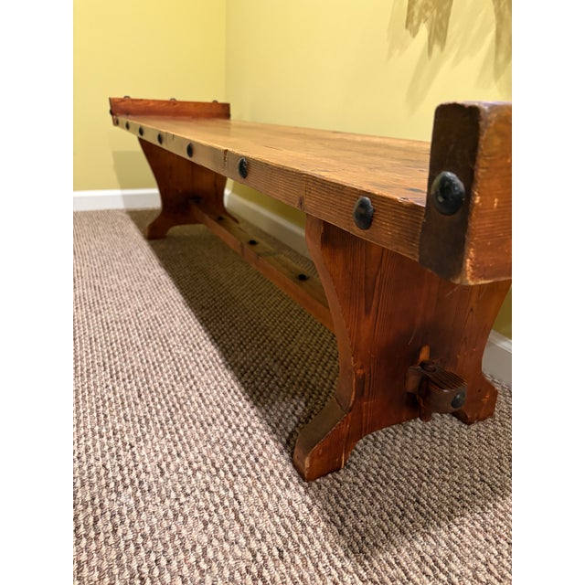 Vintage Spanish Colonial Rustic Pine Trestle Style Bench. Made from thick solid wood, with a warm reddish-brown stain that...
