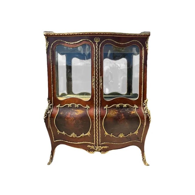 A stunning pair of French Louis XV style grand vitrines in the manner of Vernis Martin, circa 1900. Decorated with flame...