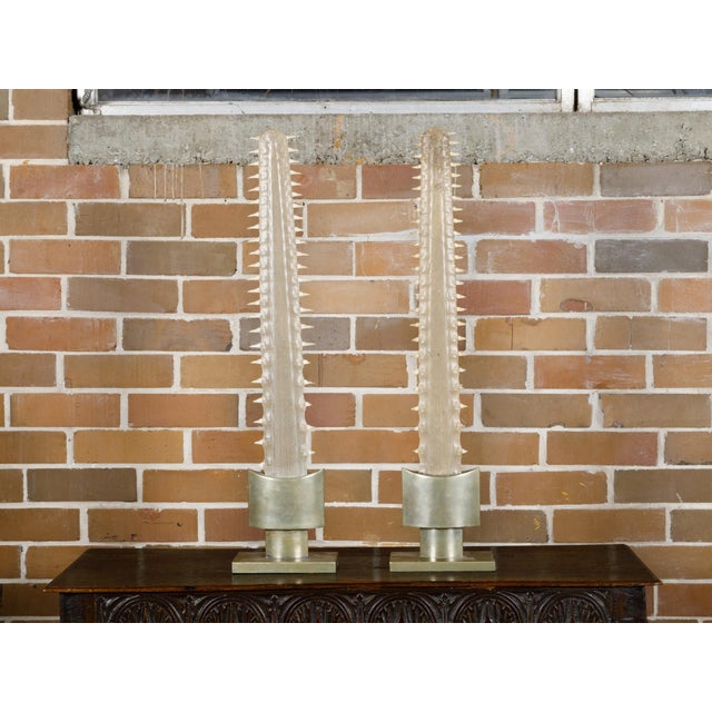 A pair of signed Anthony Redmile English sawfish decorative objects from circa 1970 mounted on brass bases. This exquisite...