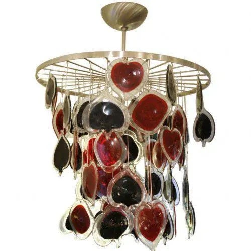 A unique “Poker” ceiling light brush steel frame with glass components in red and black in the shape of the four poker...