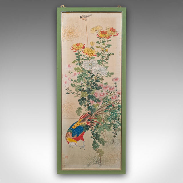 This is a tall vintage wall panel. An Oriental, watercolour on silk depicting a golden pheasant and foliate scene, dating...