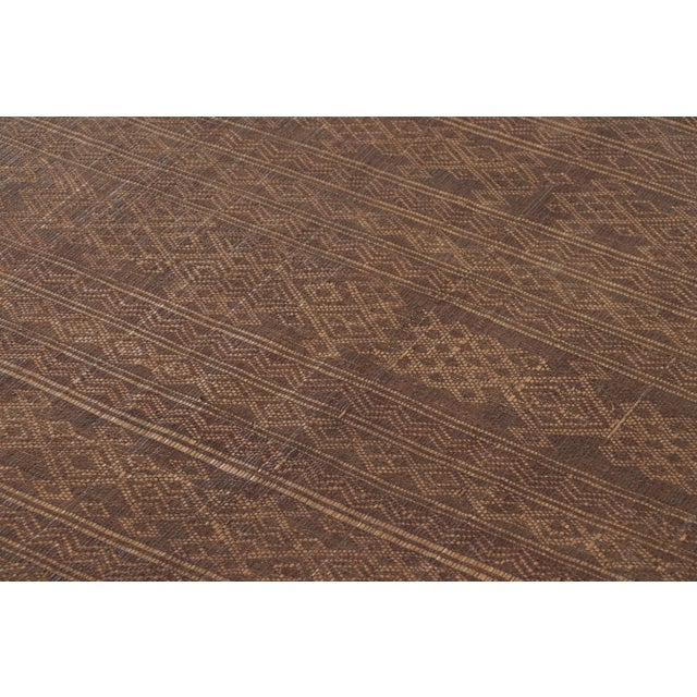 This vintage Moroccan Tuareg square 4x4 mat, dating to circa 1950-1960, reflects the distinctive weaving traditions of the...