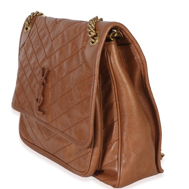 Item #: Z154156 Interior Material: Fabric Size: Medium Features Interior: One zip pocket. Two slip pockets Dimensions:...