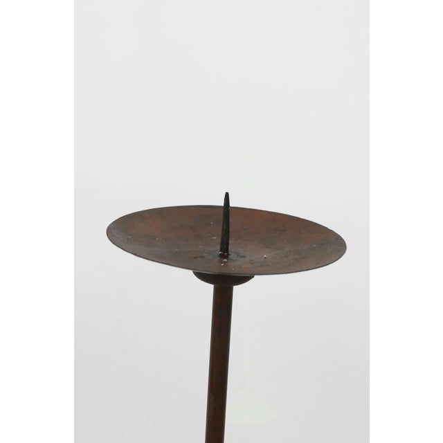 Sculptural floor candleholder set in dark brown with curled feet. Set of 3. Candles not included. Material Iron Condition...