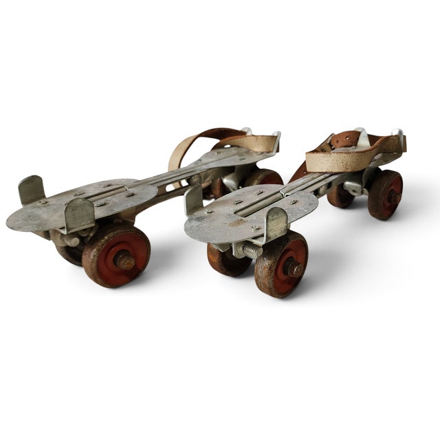 Pair Vintage 1950s Union #5 Adjustable Metal Roller Skates. In good condition. Rust to wheels. Original leather straps.