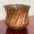 Hand-hammered copper planter with a flared, gently scalloped rim. Swirled flutes run around the body. Rows of stamped dots...