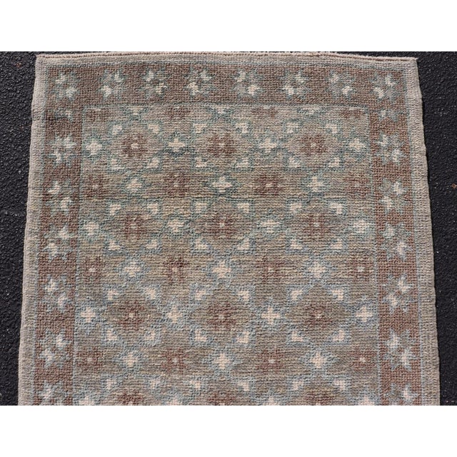 Measures: 2'10 x 10'2 Turkish Oushak Runner with Repeating Floral Motif in Taupe and Seafoam Green. Keivan Woven Arts. rug...