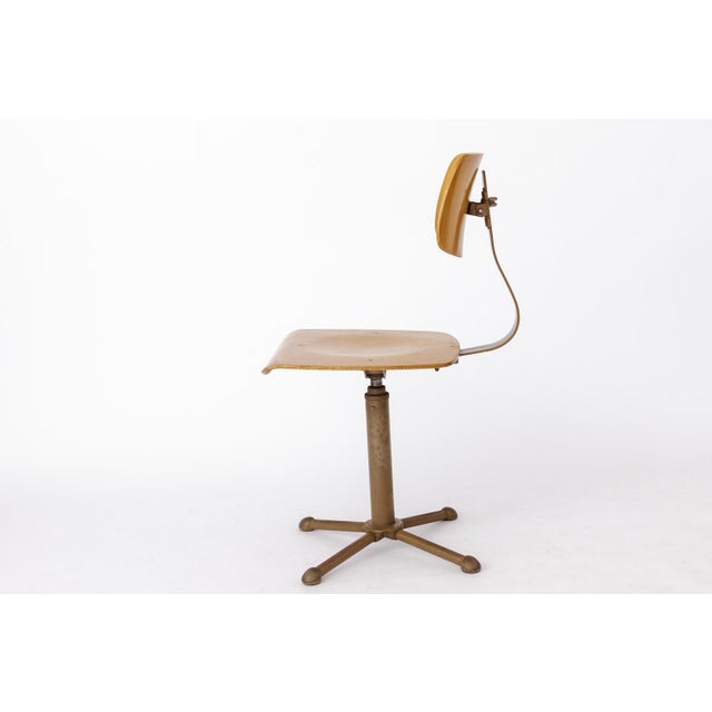 Industrial desk chair - approx. 1950s, Germany. Sturdy chair frame. Beech wood on seat and back. Metal feet.