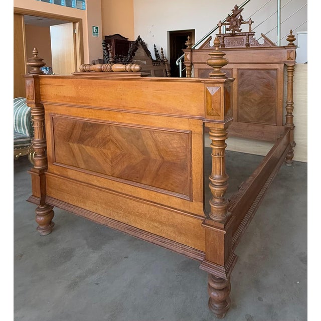 An Exquisite antique French Louis XVI full size bed. Made of Rosewood featuring foliate carved ribbon and crest with...