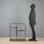1970s bar cart with a brass frame, featuring smoked glass shelves that add elegance and functionality. Equipped with a...