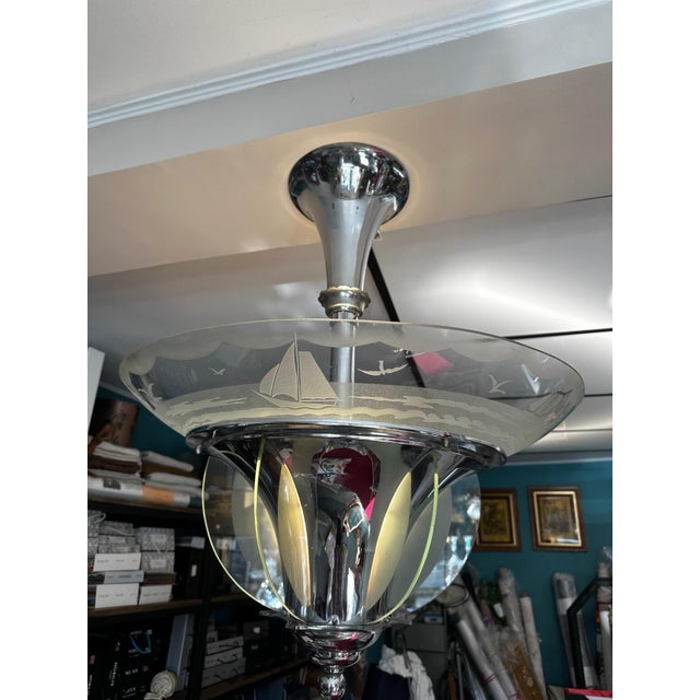 An elegant Art Deco chandelier dating from the 1930s, crafted in Lyon, remarkable for its clean lines and delicate...