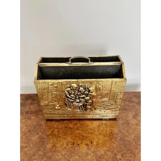 Antique ornate quality brass newspaper stand having a quality brass newspaper stand with ornate decoration of people...