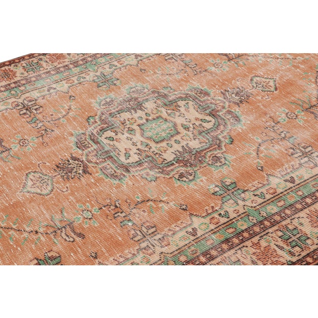 Hand-knotted in wool, this 5x9 vintage Turkish rug is from that collection of mid-century rugs with antique washes giving...
