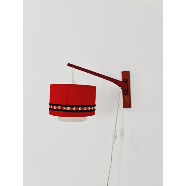 Danish teak wall lamp with nice shade by aro leuchte 1960s both the shade and the lamp are in amazing condition....