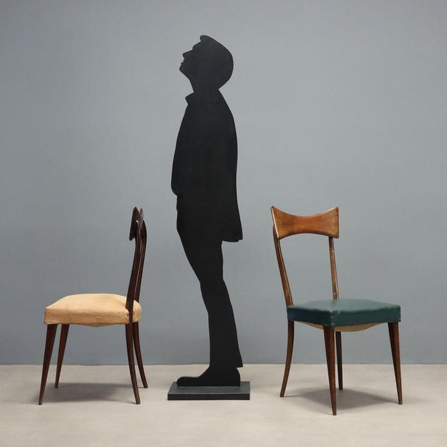 Vintage chairs from the 1950s-60s, crafted from stained beech wood. These pieces feature an elegant structure,...