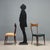 Vintage chairs from the 1950s-60s, crafted from stained beech wood. These pieces feature an elegant structure,...