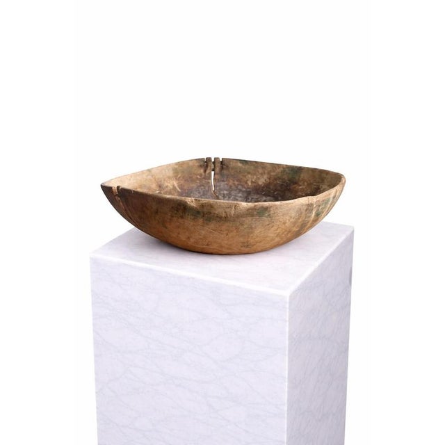A rare and deeply evocative Swedish hand-carved wooden bowl dating to the late 18th century, circa 1750. Crafted from...