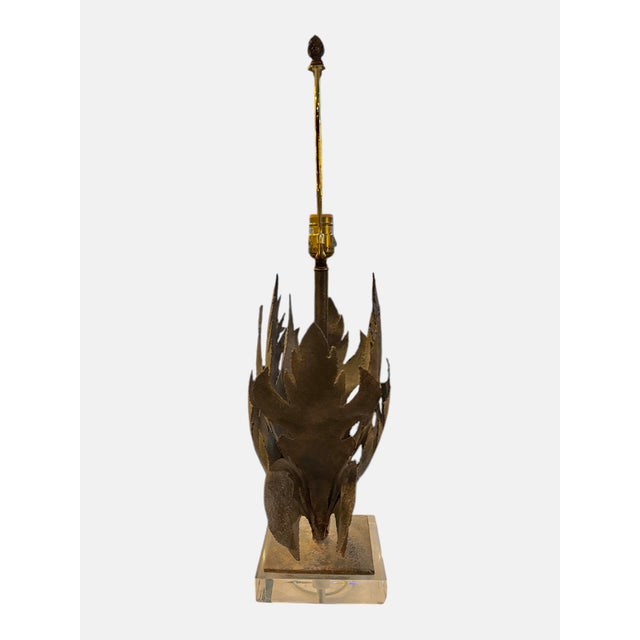 This Brutalist Iron Leaf Lamp with Lucite Base seamlessly blends industrial strength with artistic elegance. The...