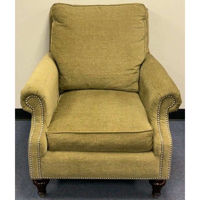 Handsome upholstered chair in a lovely pistachio green color.Features a classic silhouette with rolled arms and an ornate...
