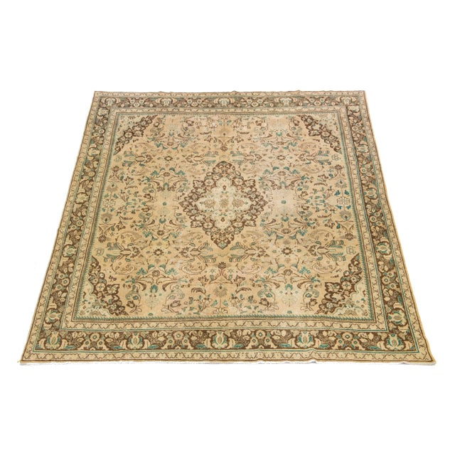 Beautiful Vintage Mahal hand-knotted wool rug with a tan color field. This Persian rug has classic green and brown hues...