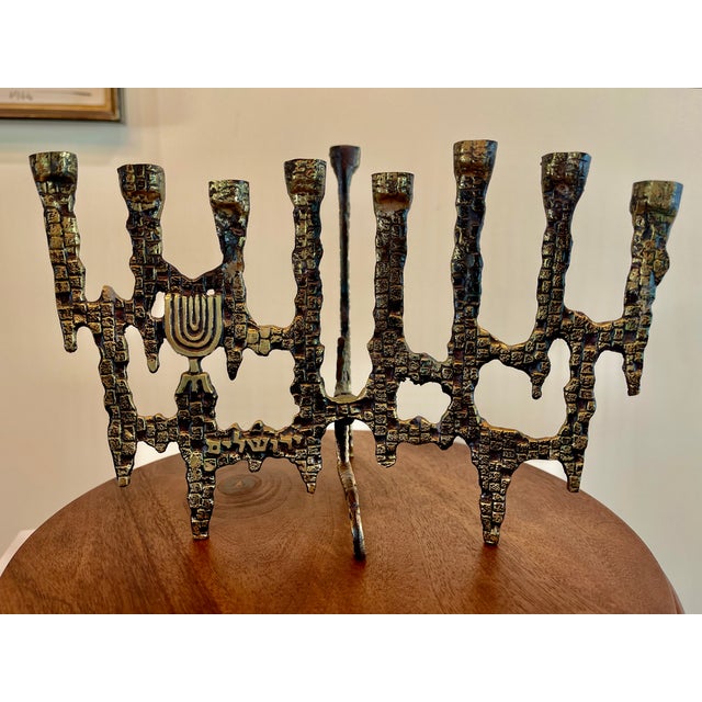 Solid brass mid century menorah in the style of Hakuli for Frederick Weinberg. This Brutalist style focuses on elemental...