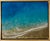 This mixed media piece captures the tranquil essence of ocean waves lapping against a sandy shore. The vibrant turquoise...