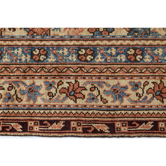 This striking Antique Turkish Oushak rug, woven circa 1900, is a remarkable representation of Anatolias enduring artistic...
