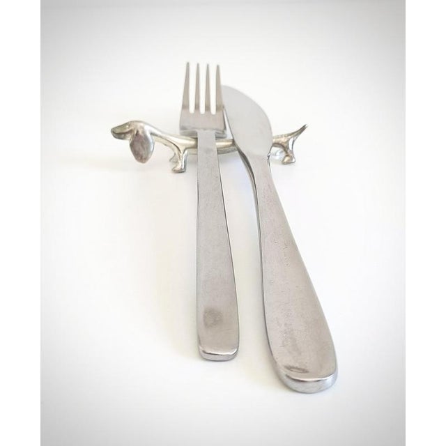 Set of Six Metal Dachshund Cutlery Rests with Original Box A set of six sculptural metal cutlery rests, each cast in the...