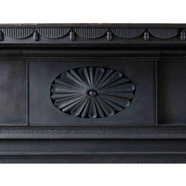 DISTINCTIVE CARVED FEDERAL MANTLEPIECE; New York, c. 1818 This large mantle shelf, with its original black painted...