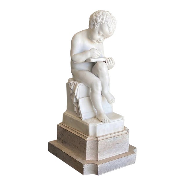 Early 20th Century Italian Porcelain Bisque Figure of a Putto Writing After Canova For Sale