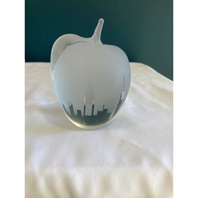 This vintage glass apple paperweight features a striking etched New York City skyline design, capturing the iconic spirit...