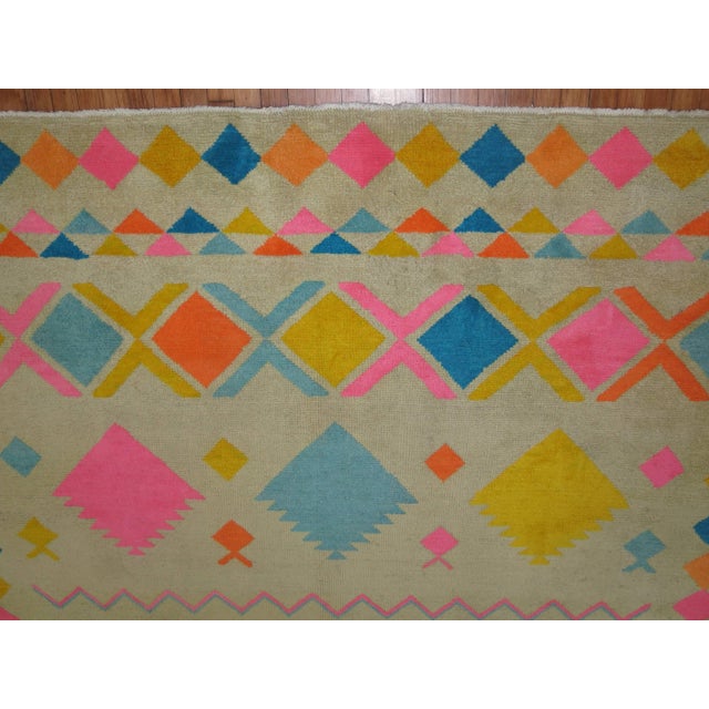 A dynamic colored one of a kind mid-20th century Turkish rug accents in bright pink, orange, blues. We have never seen...