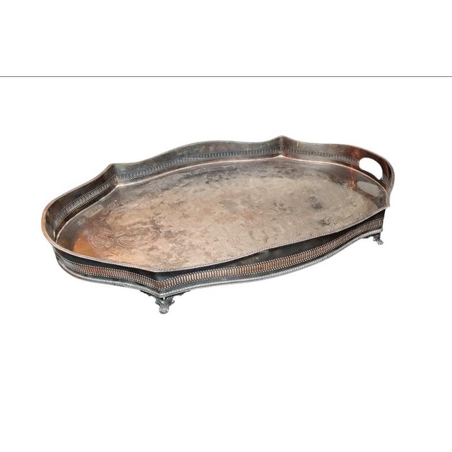 For your consideration . . . A fabulous substantial ornate hand chased oval serving tray with integrated side handles....