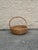 Exceptional oversized vintage wicker gathering basket, handwoven with a substantial sculptural handle and beautifully aged...