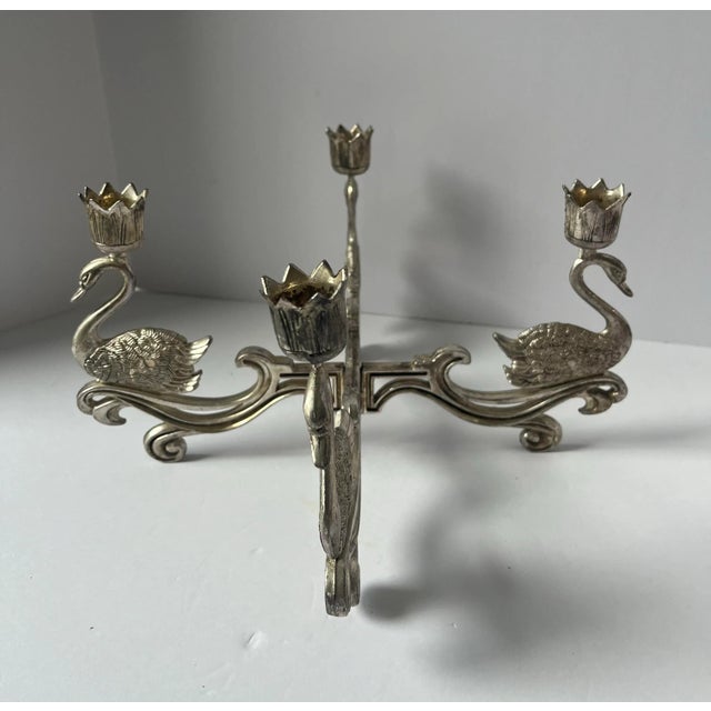 A beautiful vintage 4 arm candelabra featuring beautiful swans and elegant curved detail. The candleholder comes apart...