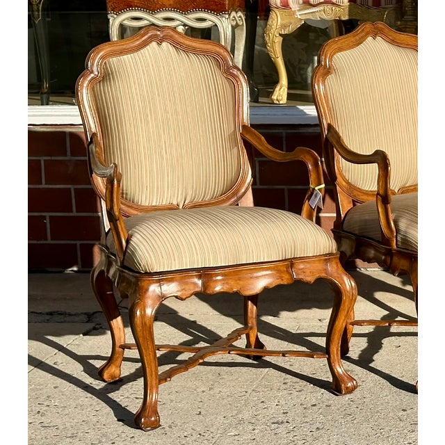 Set of 18th C Style Therien Studio Workshops Venetian Walnut Dining Arm Chairs. Each is freshly upholstered in elegant...