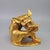 This finely cast gilt bronze sculpture depicts a Qilin, a mythical hooved creature from traditional folklore, in a seated,...