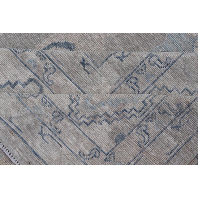 Turkish Oushak Rug With Soft Gray Field and Pale Blue Geometric Motifs For Sale - Image 15 of 16