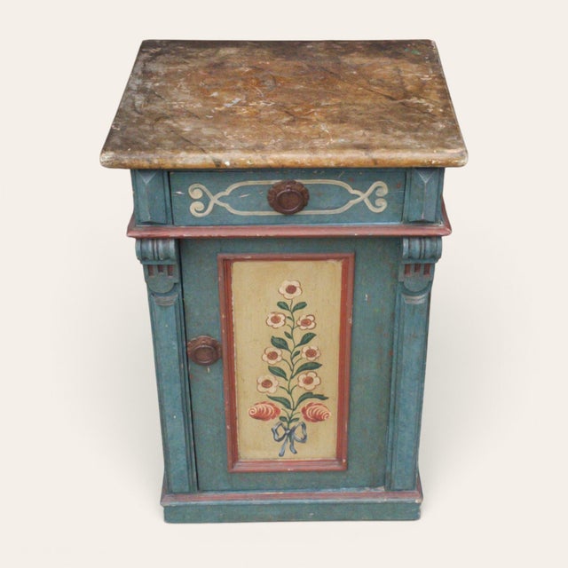 European folk-painted cabinet featuring a drawer above a cupboard door, retaining its original blue-green painted finish,...