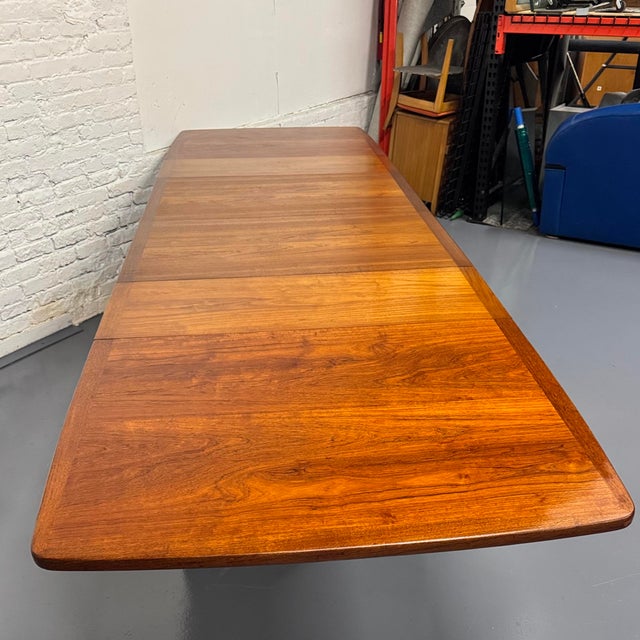 In 20+ years in the MCM furniture business we've never seen a Danish teak dining table this expandable. With two 14.25"...